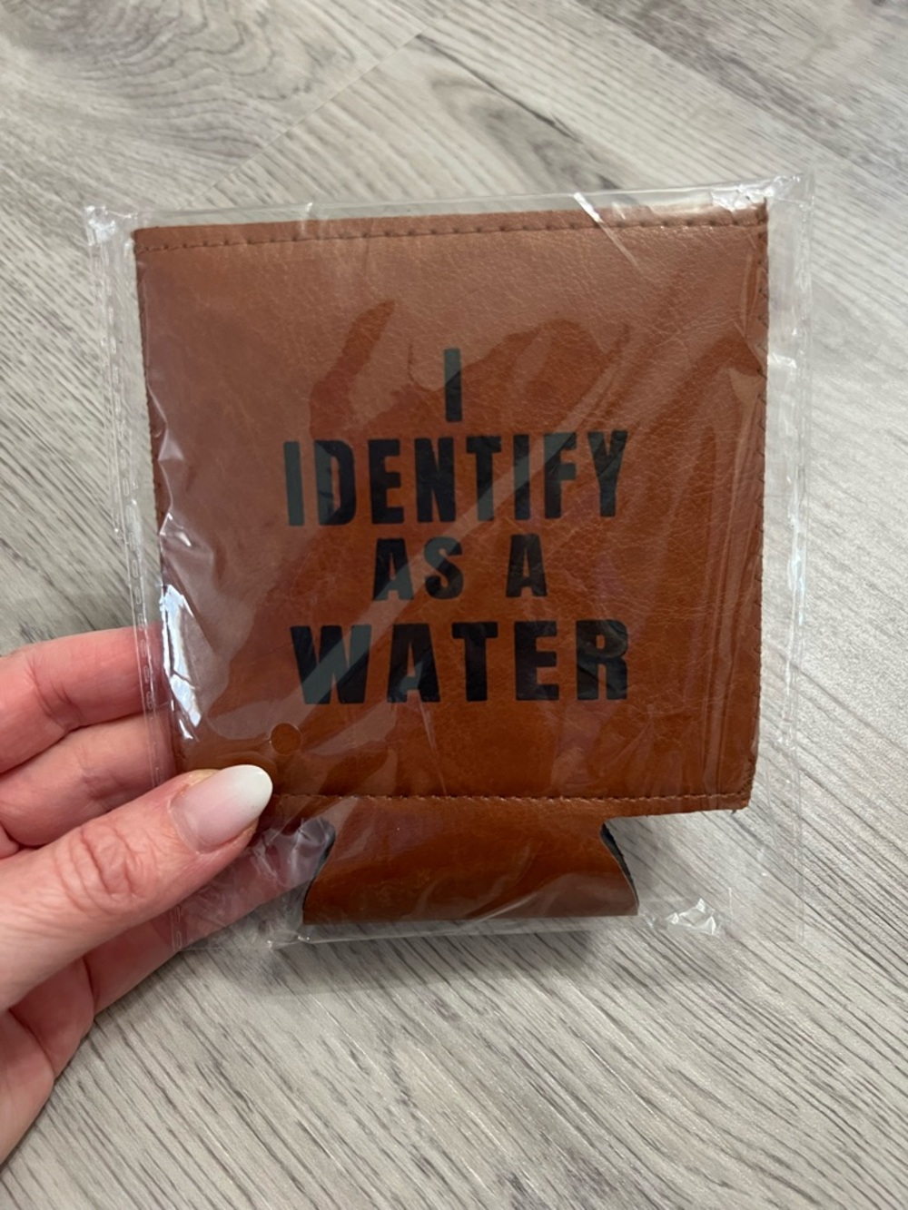 Leather “I identify as water” koozie
